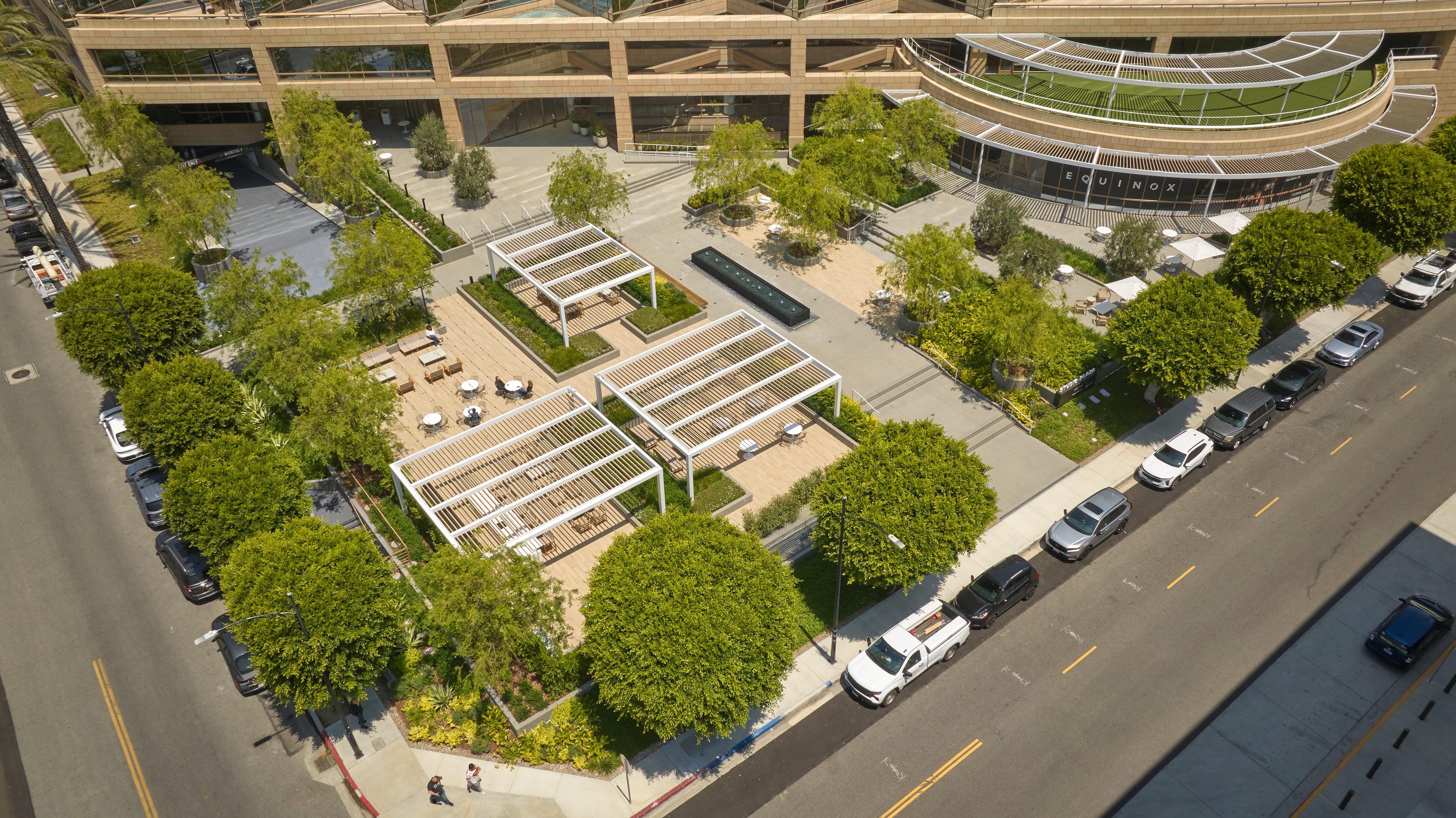Aerial view of Studio Plaza's outdoor courtyard with pergola seating areas and landscaping.