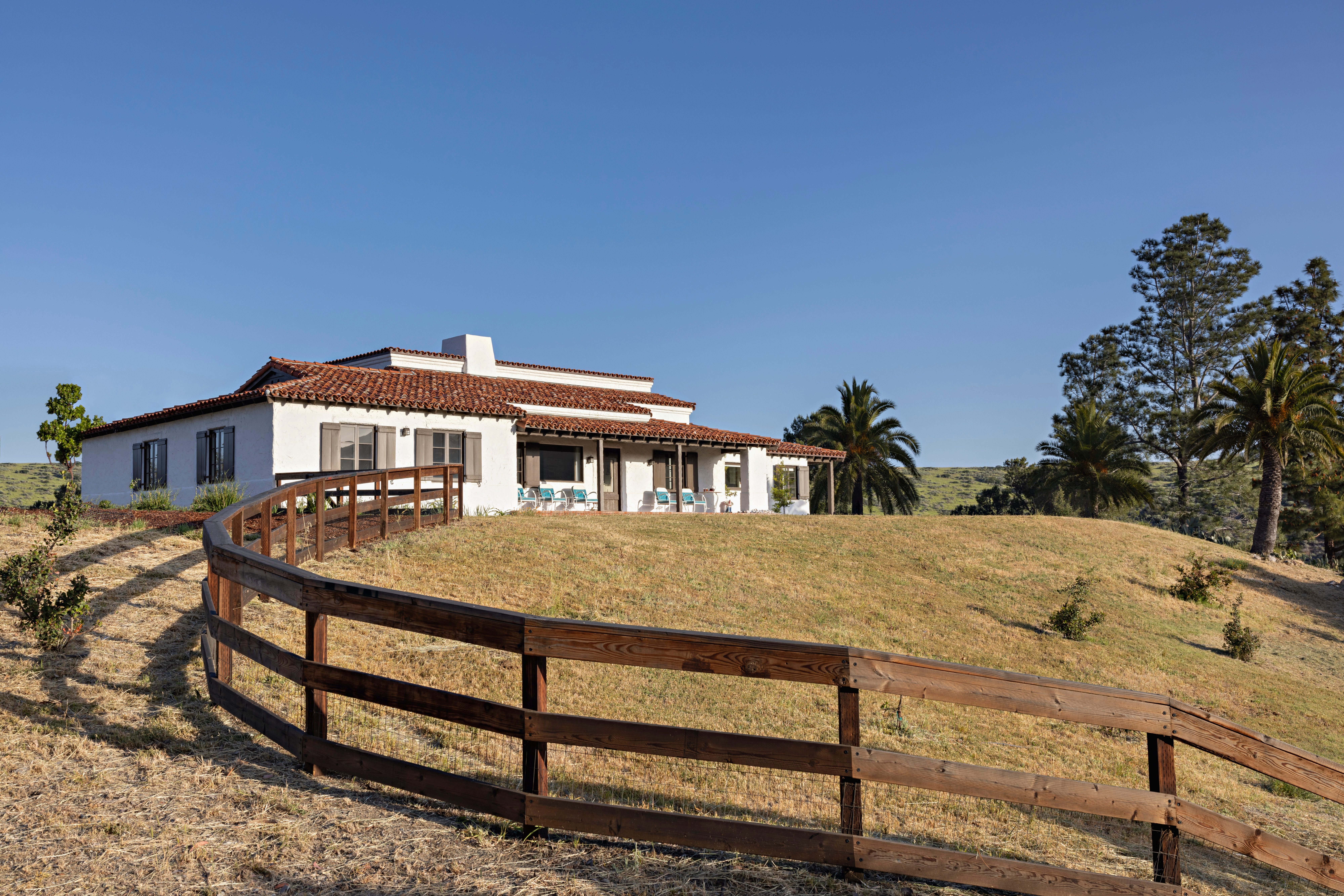 Hilltop ranch house with wood fence on Catalina Island.